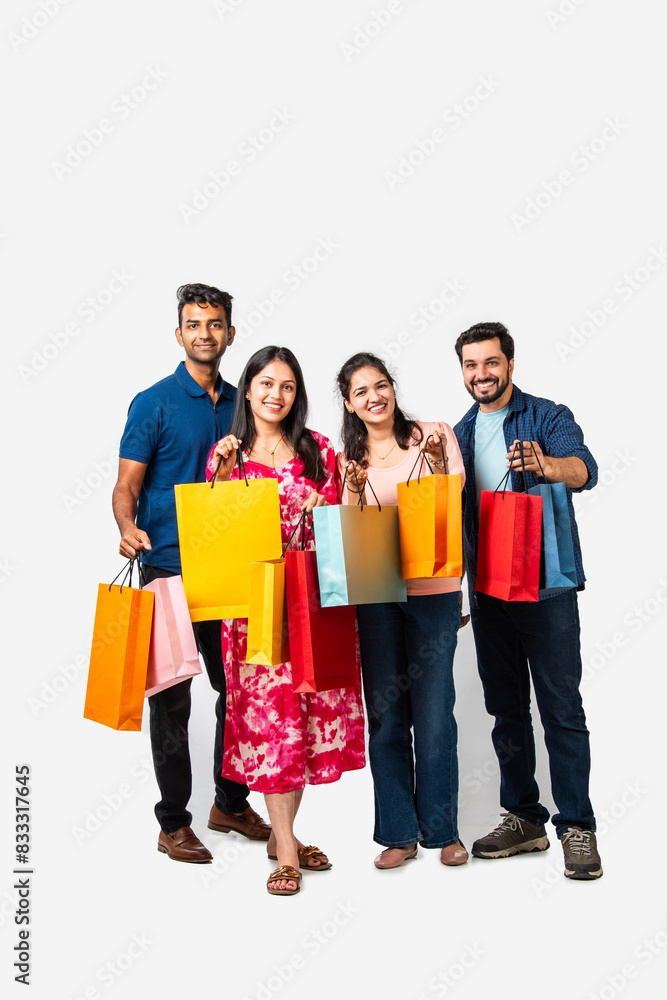 Indian asian young friends enjoying after shopping, showing colo Indian asian young friends enjoying after shopping, showing colo