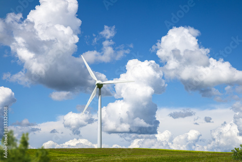 Wind Turbine on a Hill with Blue Sky and Clouds