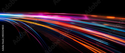 High-speed light trails on a dark background, long exposure effect with colorful lights and fast motion lines in the night road for a business technology concept design in the style of fast motion. photo