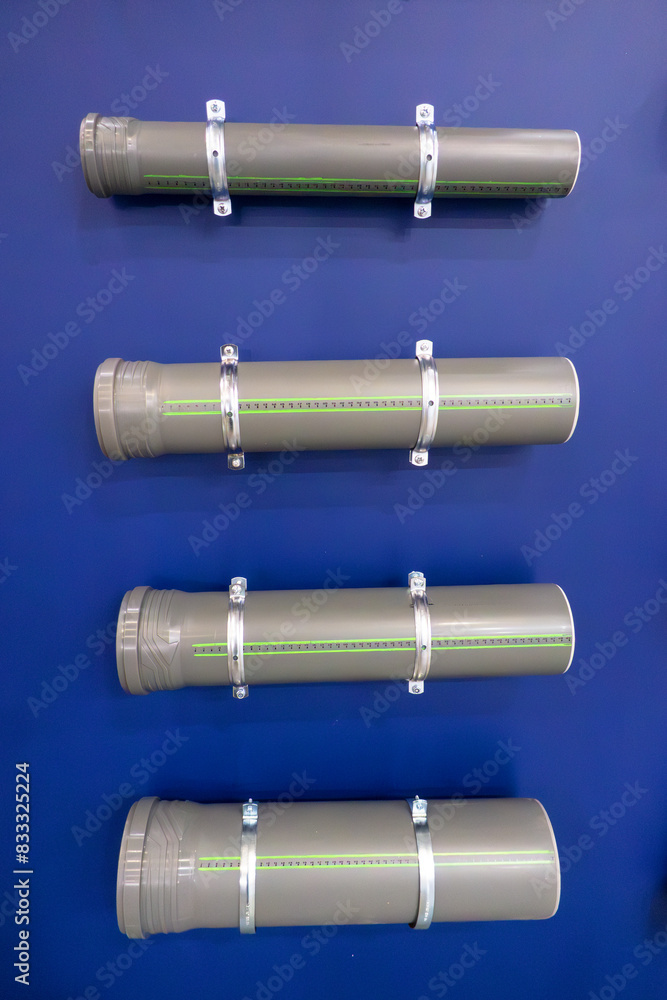 Plastic pipes of different diameters of gray color. Plastic pipes of different diameters of gray color.