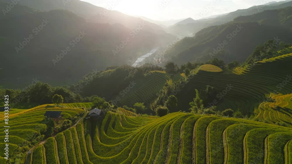 Aerial top view of fresh paddy rice terraces, green agricultural fields in countryside or rural area of Mu Cang Chai, mountain hills valley in Asia, Vietnam. Nature landscape background. Aerial top view of fresh paddy rice terraces, green agricultural fields in countryside or rural area of Mu Cang Chai, mountain hills valley in Asia, Vietnam. Nature landscape background.