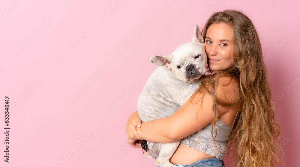 Cheerful young woman with her pretty dog isolated on light pink background, Cheerful young woman with her pretty dog isolated on light pink background,