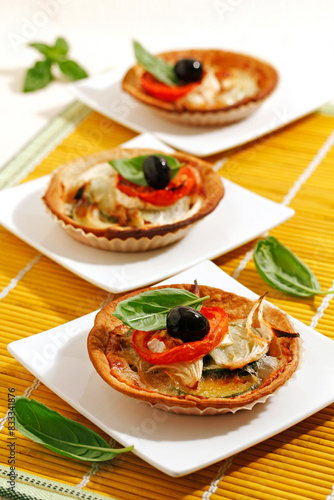 Tartlets with vegetables and cheese.