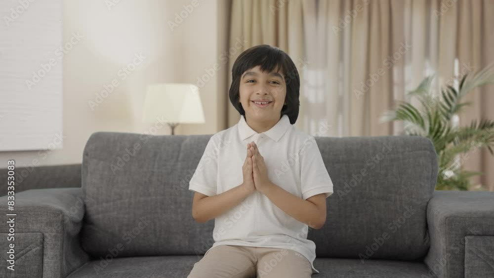 Cute Indian boy doing Namaste and greetings Cute Indian boy doing Namaste and greetings