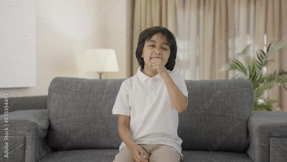 Sick Indian boy suffering from cold and cough