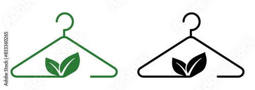 Green hanger icon. Slow fashion vector symbol. Recycling fabric sign. Sustainable textile pictogram.