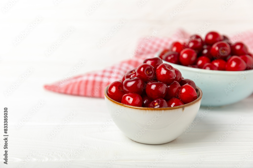 Cherries. Fresh ripe cherries with leaves on a textured wooden background. Fresh sweet organic cherry pile. Berries and fruits. Vegan. Healthy eating. Place for text. Copy space Cherries. Fresh ripe cherries with leaves on a textured wooden background. Fresh sweet organic cherry pile. Berries and fruits. Vegan. Healthy eating. Place for text. Copy space