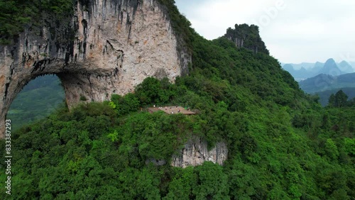 Yangshuo Yueliang Shan stone arch in Guilin also known as Moon Hill, China. Aerial dolly out photo