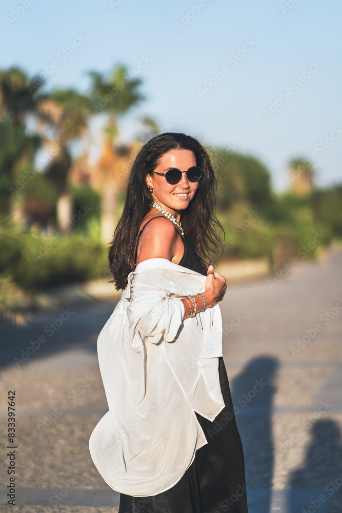Woman in white top and black pants Woman in white top and black pants