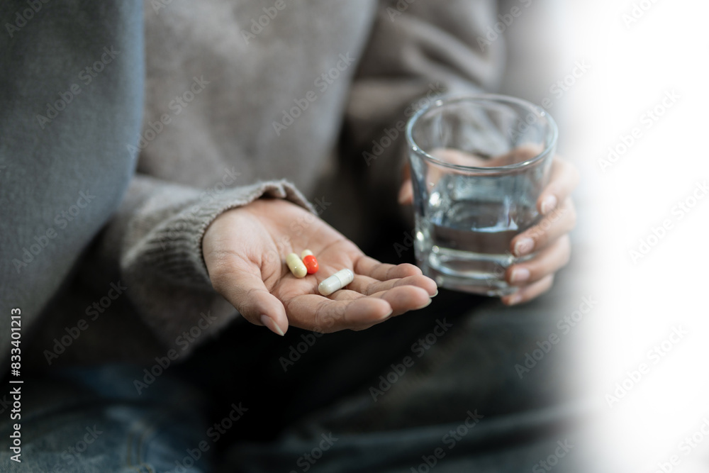 medicine, Sad and depressed young female sitting on the sofa, sad mood, feel tired, lonely and unhappy concept. medicine, Sad and depressed young female sitting on the sofa, sad mood, feel tired, lonely and unhappy concept.