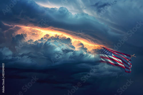 Storm cloud formation serves as a dramatic backdrop for a praying soldier silhouette made from an American flag, conveying Memorial Day solemnity. photo