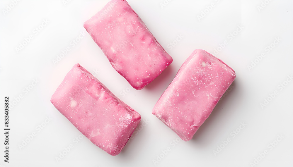 Tasty pink chewing gums on white background, top view Tasty pink chewing gums on white background, top view