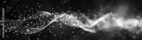 Abstract black and white image featuring dynamic light particles and waves creating a sense of movement and energy. photo
