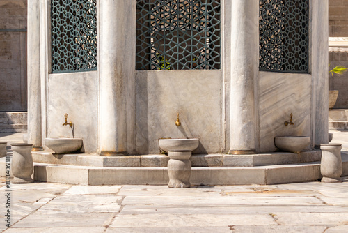Detail of the fountain used for ablution in the New Mosque complex in Eminönü, Istanbul photo
