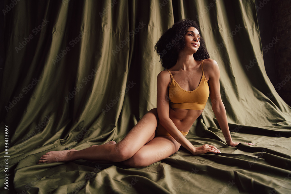 No retouch photo of dreamy pretty adorable girl advertise stylish activewear isolated on fabric khaki color background No retouch photo of dreamy pretty adorable girl advertise stylish activewear isolated on fabric khaki color background
