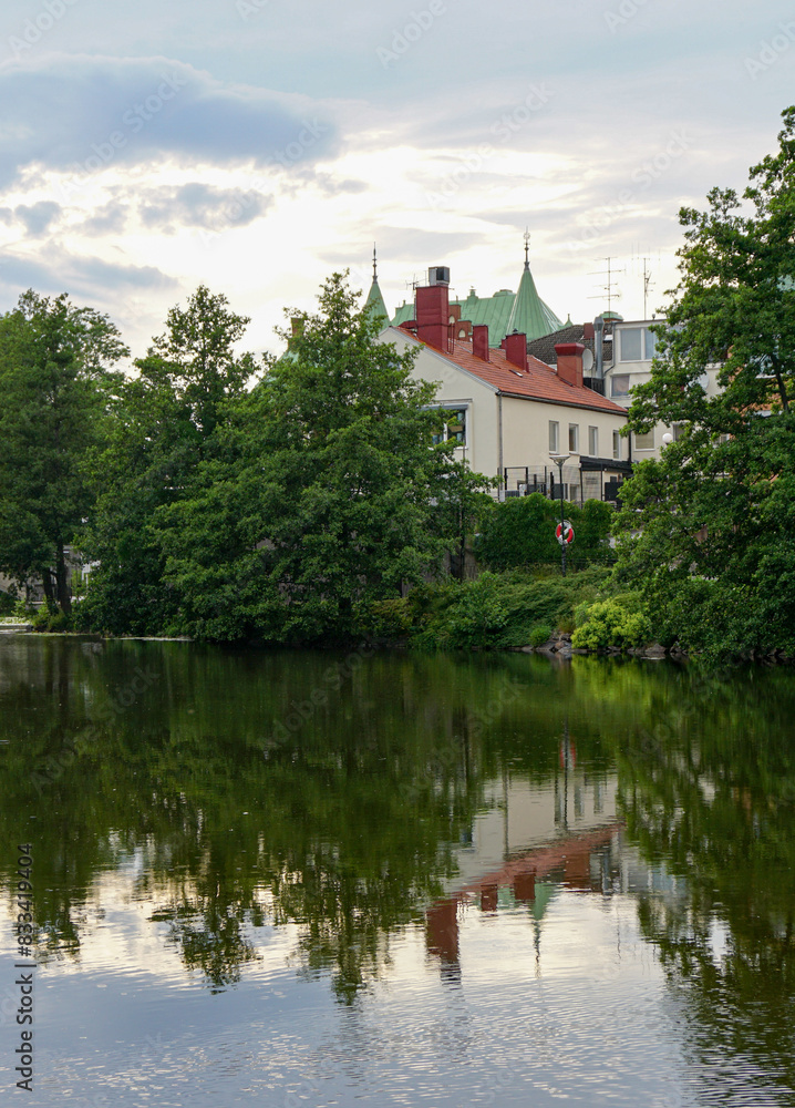 View of a building by the lake during evening View of a building by the lake during evening