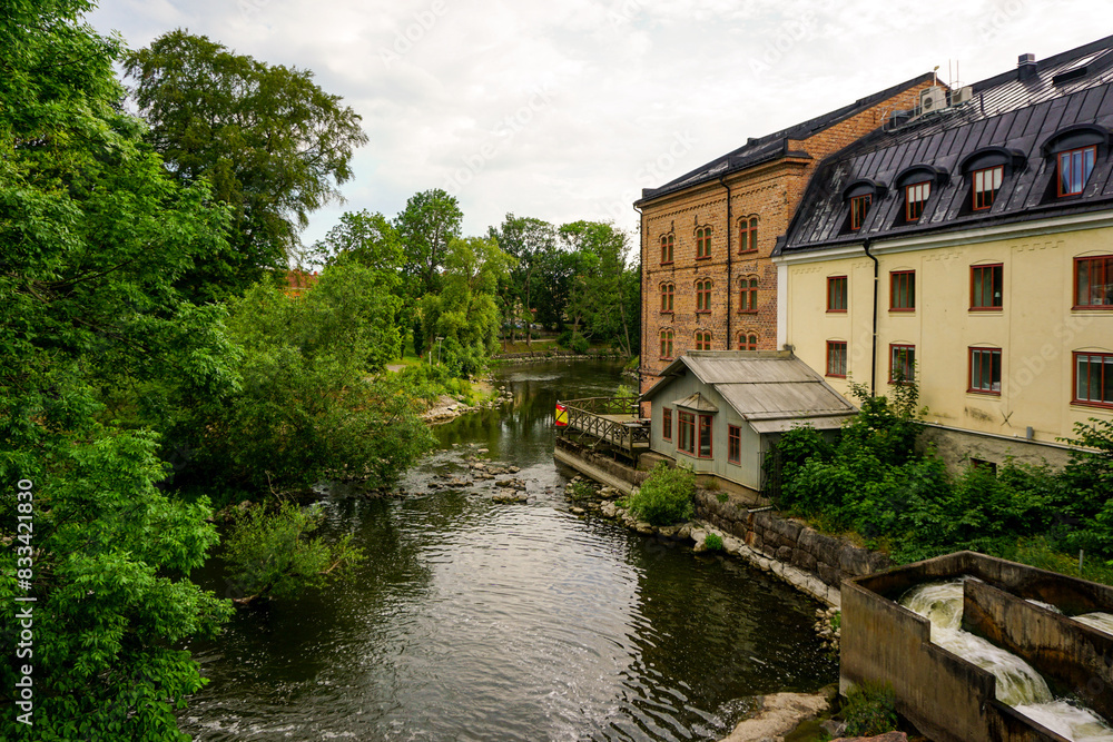 View of buildings by a stream