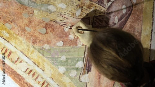  Caucasian Woman Working With Extreme Care and Patience on an Ancient Fresco in Accordance With Cultural Heritage Expertise Restoring Procedures 