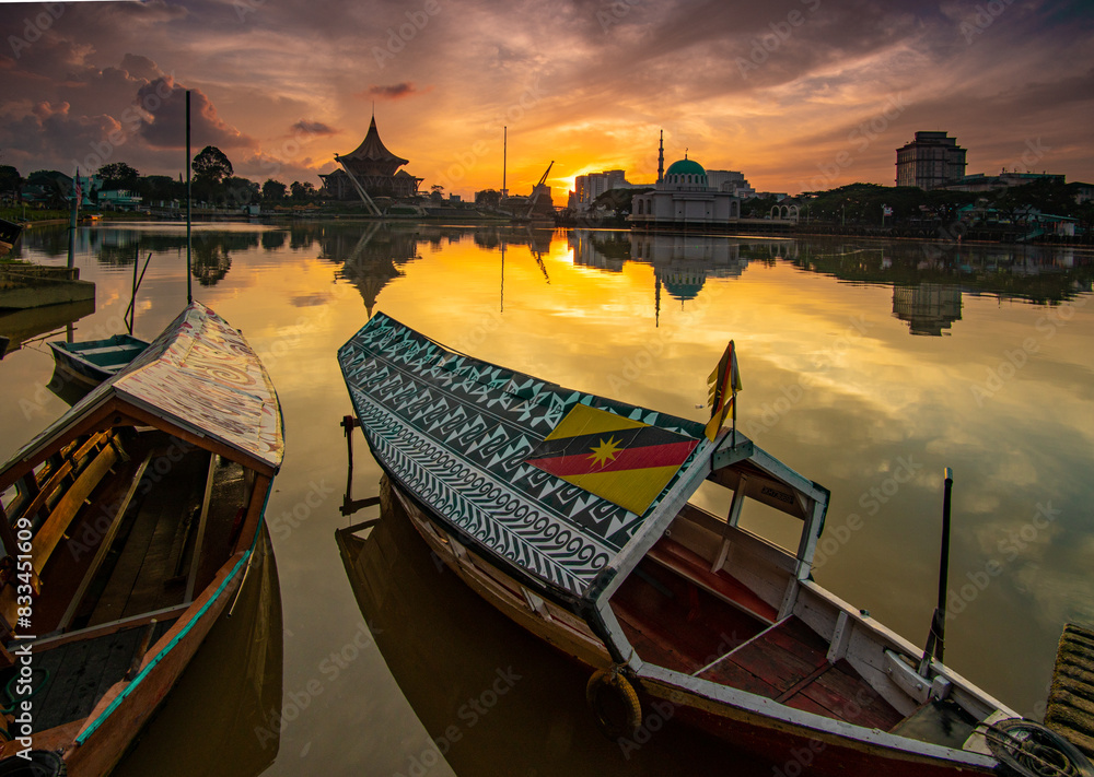 Naklejka premium sunset over the river at kuching, sarawak