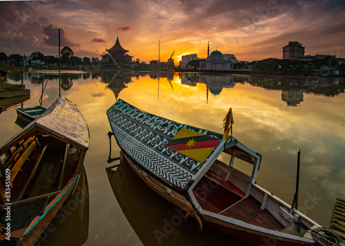 Obraz na płótnie sunset over the river at kuching, sarawak