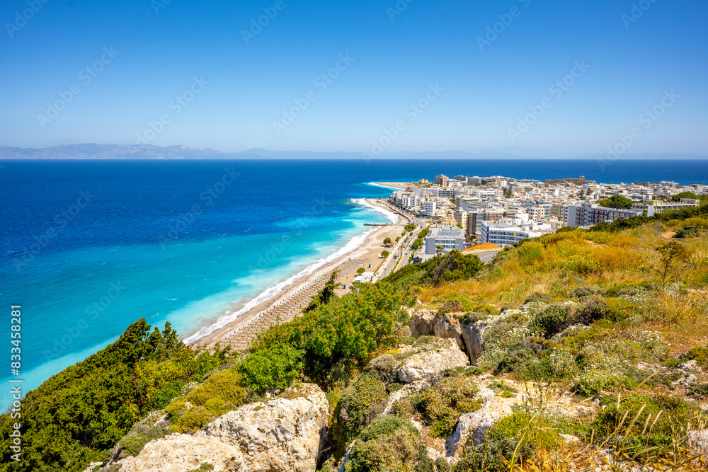 Aegean beach with sunshades in city of Rhodes (Rhodes, Greece) Aegean beach with sunshades in city of Rhodes (Rhodes, Greece)