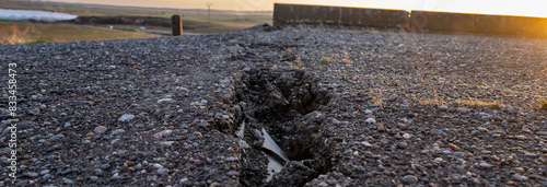 фотографія Cracked old asphalt, road safety concept