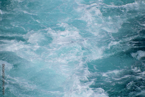 waves broken by the ferry - water background