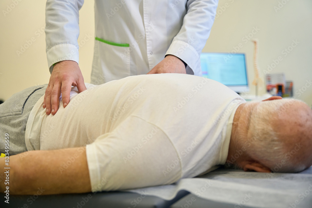 Patient lying on couch in doctor office Patient lying on couch in doctor office