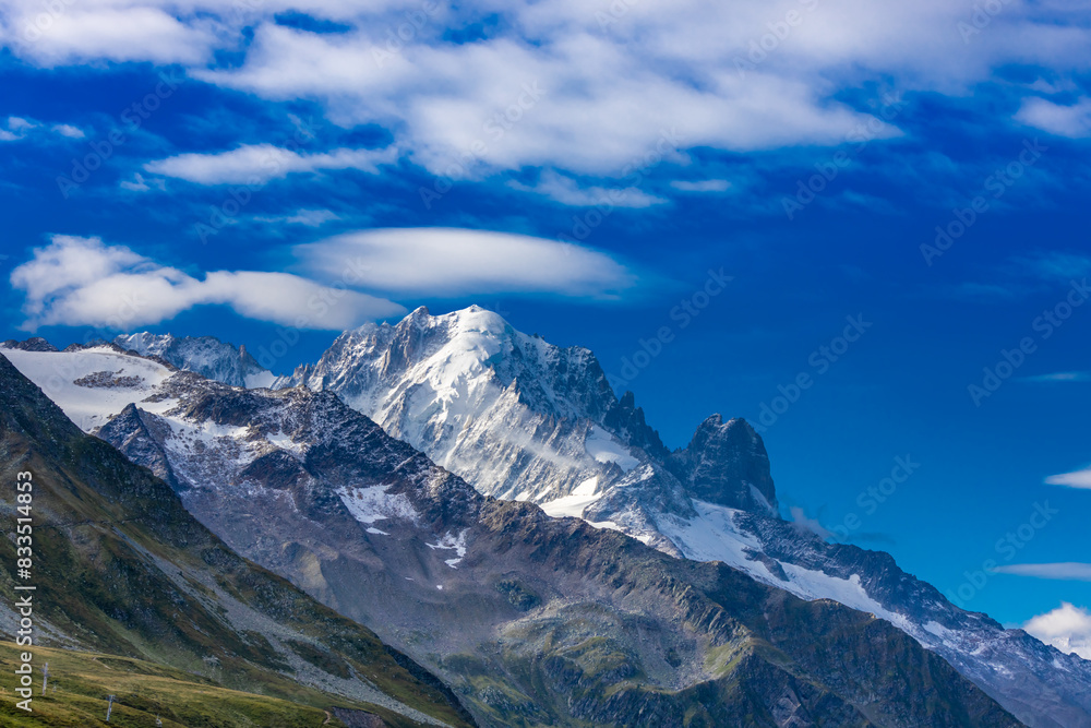 Chamonix Montblanc beautiful alpine mountain summits landscape. Alps mountains with snow and glacier above green valley of Chamonix in France. Alps beautiful scenery in summer Chamonix Montblanc beautiful alpine mountain summits landscape. Alps mountains with snow and glacier above green valley of Chamonix in France. Alps beautiful scenery in summer