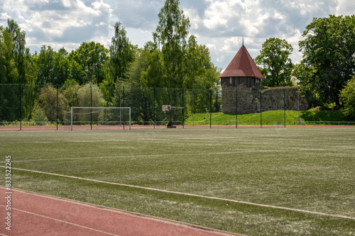 Running track and football field next to ancient fortifications in Pilssala, Aluksne photo