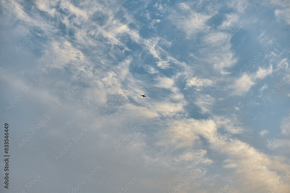 Kite flying high in the sky with scattered clouds, tranquil image of outdoor leisure activity Kite flying high in the sky with scattered clouds, tranquil image of outdoor leisure activity