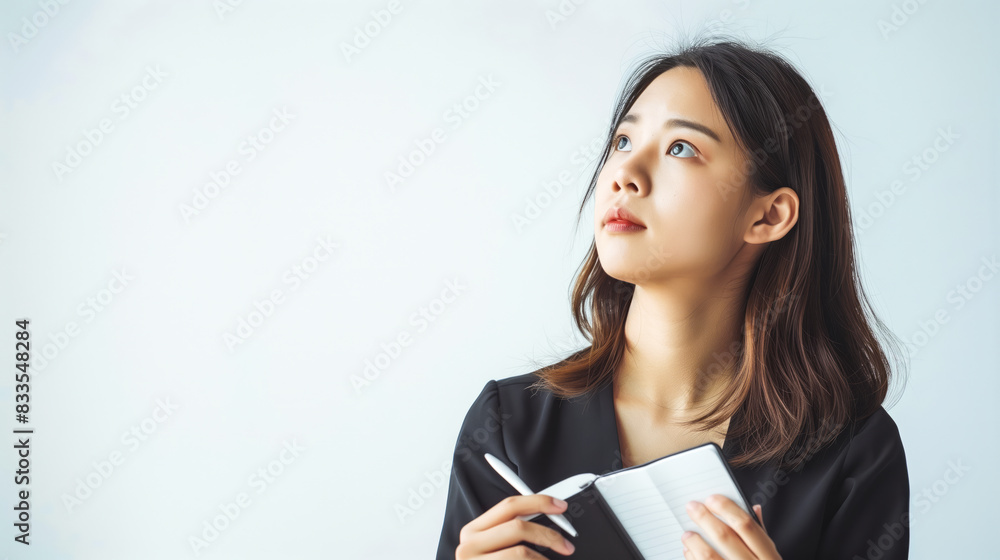 Chinese corporate woman with a pensive look Chinese corporate woman with a pensive look