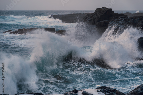 waves beating against the rocks in El Puertillo at sunset. Arucas. Gran Canaria. Canary islands