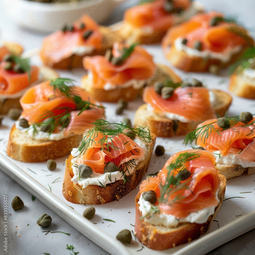 a sumptuous serving of canapes with fresh smoke salmon served with capers, loaded with a special sauce blended with herb and spices a sumptuous serving of canapes with fresh smoke salmon served with capers, loaded with a special sauce blended with herb and spices
