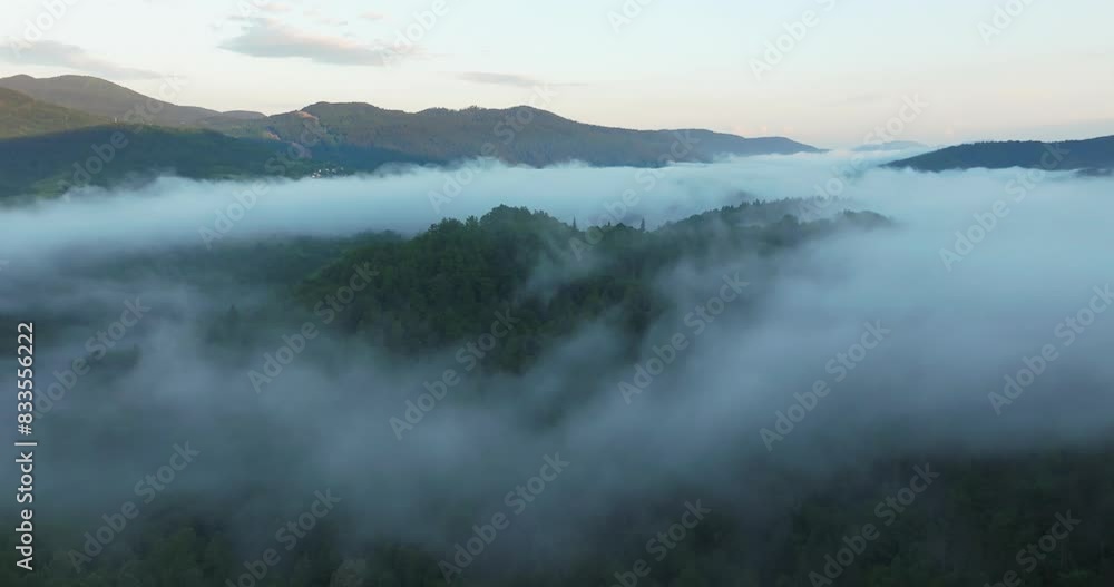 Aerial view of dawn with golden morning mist in a mountain valley, Croatia Aerial view of dawn with golden morning mist in a mountain valley, Croatia