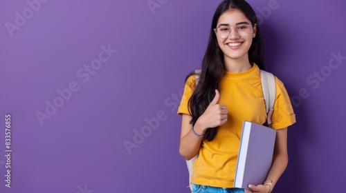 The smiling student with book photo