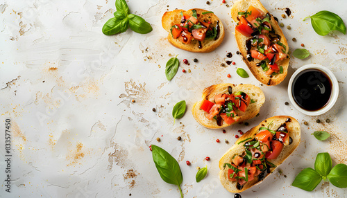 Delicious bruschettas with balsamic vinegar and toppings on light textured table  flat lay