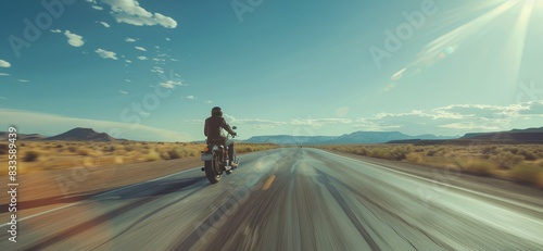 A motorcycle on desert highway photo