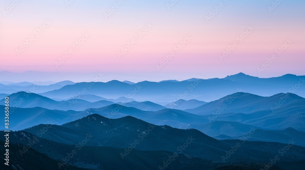 The image shows a beautiful mountain landscape with a vibrant sky full of color. The image shows a beautiful mountain landscape with a vibrant sky full of color.