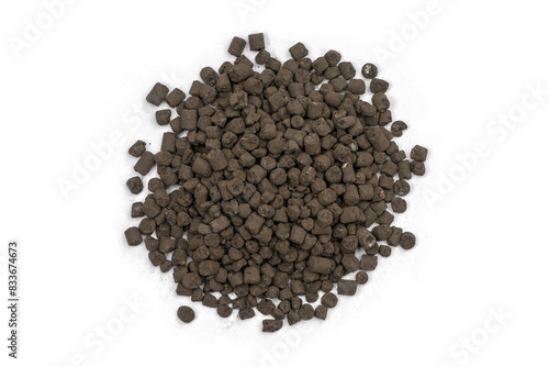 Organic-chemical fertilizer pellets on a white background