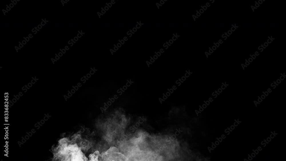 White steam swirls and rises from bottom to top. Smoke fog covers the frame, which can be blended using blending modes. Isolated seamless loop on black background. White steam swirls and rises from bottom to top. Smoke fog covers the frame, which can be blended using blending modes. Isolated seamless loop on black background.