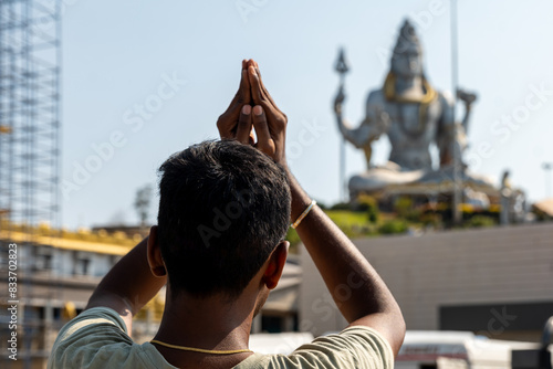 A men Devotee Praying at Hindu Temple murudeshwar photo