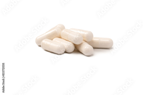 White pill capsule isolated on a white background.