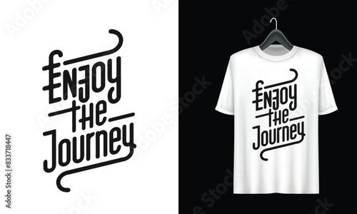 A white t - shirt with the phrase enjoy the journey.