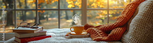 A steaming cup of coffee and a good book are the perfect way to relax on a cozy fall day