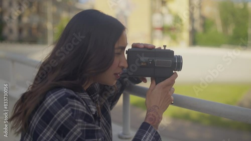 Woman Filming with Super 8 Vintage Camera photo