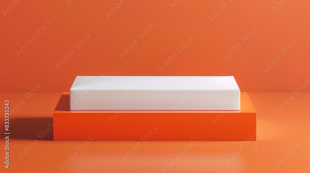 A white box is on top of an orange box A white box is on top of an orange box