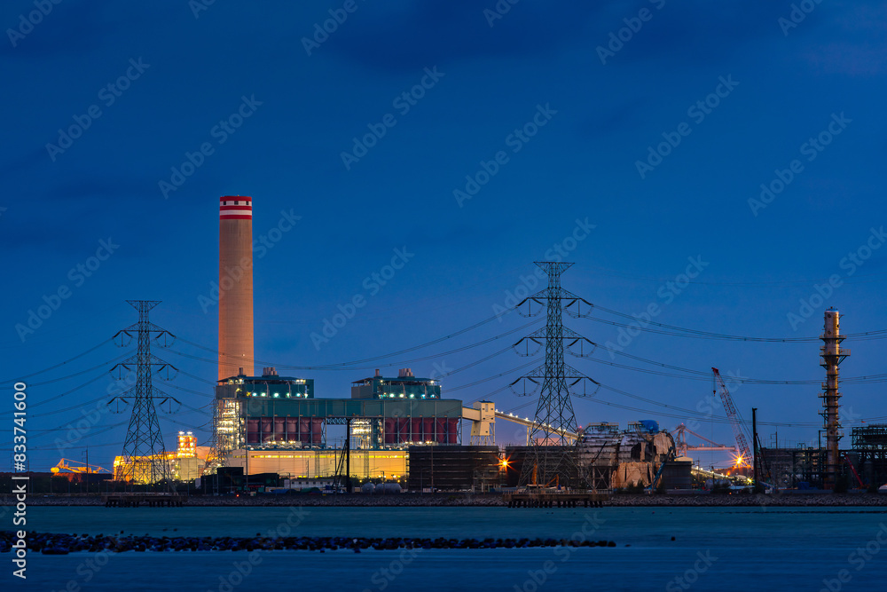 Fototapeta premium power plant factory fuel energy produce for chemical oil refinery and petrochemical business in industrial for green and eco technology business, with view of port and ocean transportation