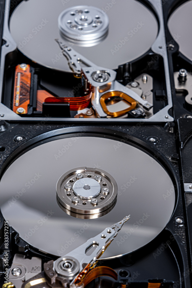 Disassembled hard drive from the computer, hdd with mirror effect. Opened hard drive from the computer hdd with mirror effects. Part of computer pc, laptop Disassembled hard drive from the computer, hdd with mirror effect. Opened hard drive from the computer hdd with mirror effects. Part of computer pc, laptop
