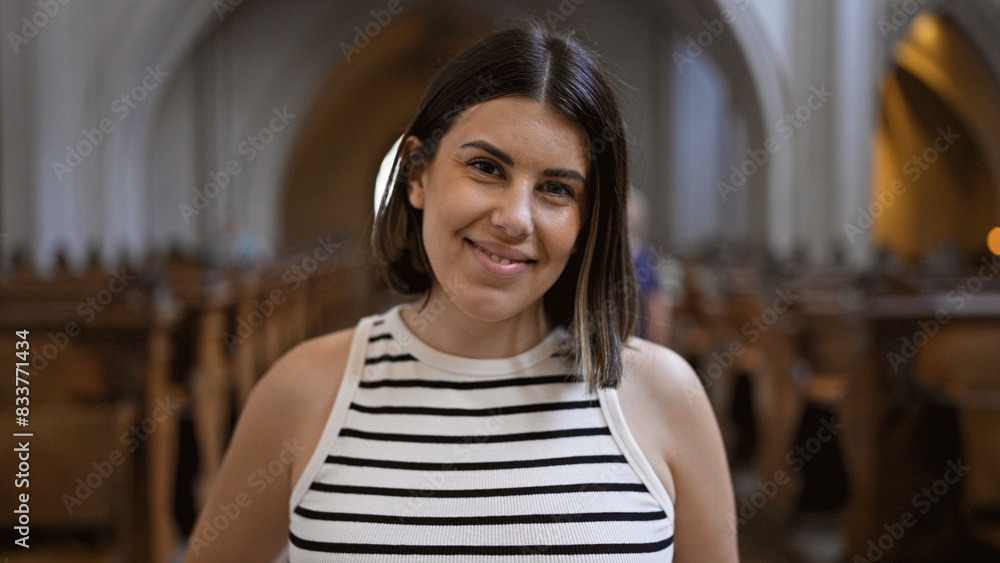 Young beautiful hispanic woman visiting church at Augustinian Church in Vienna Young beautiful hispanic woman visiting church at Augustinian Church in Vienna